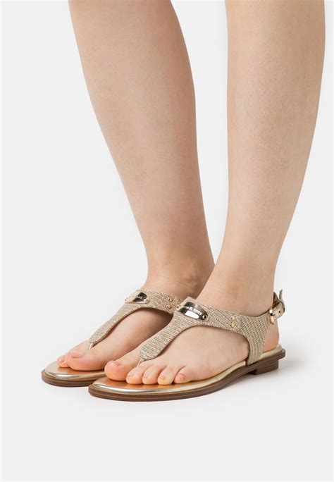 gold michael michael kors footwear mk plate thong sandal|michael kors flip flop sandals.